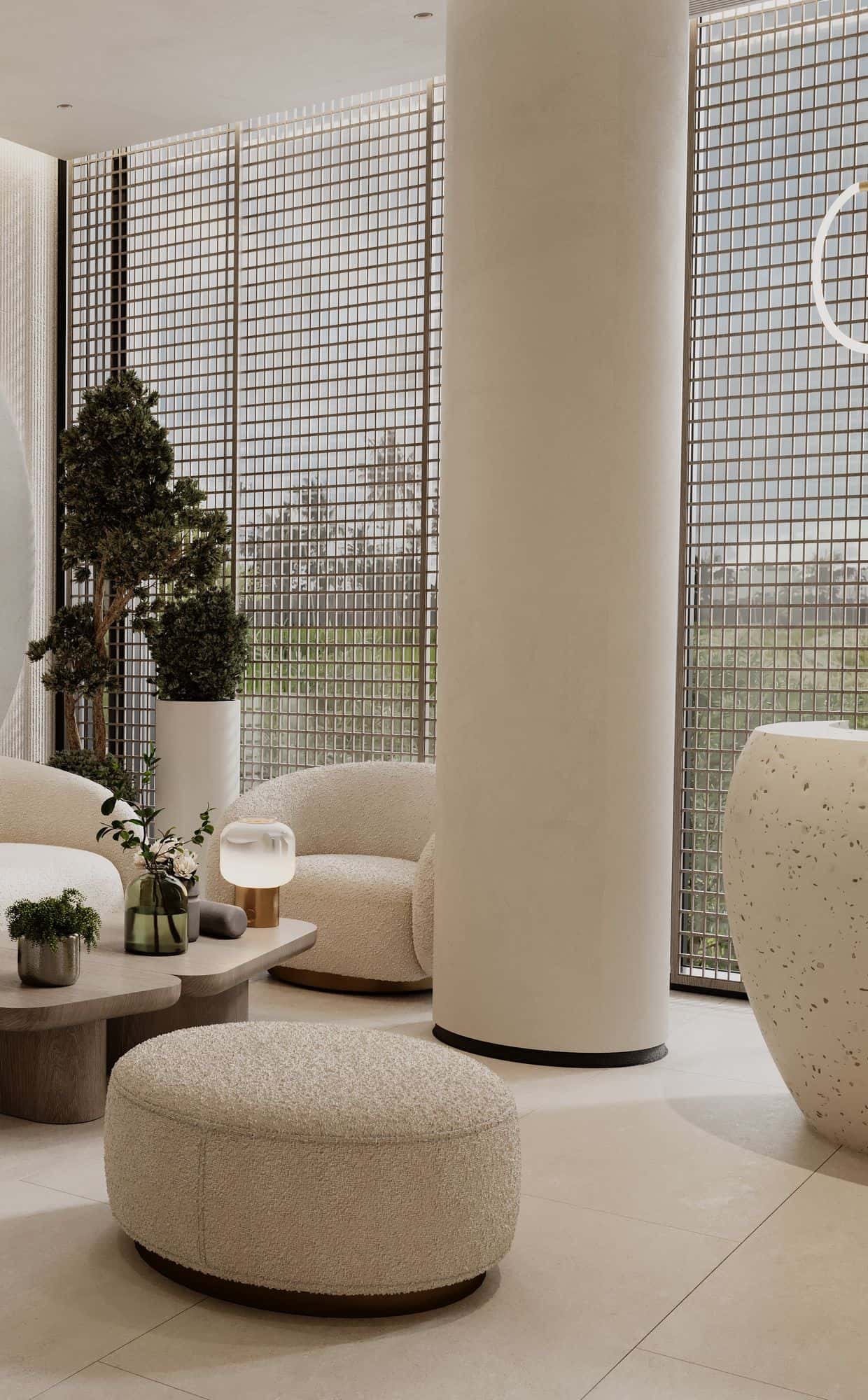 Salon lounge in warm cream tones with boucle seating, a fluted plaster wall and full-height windows
